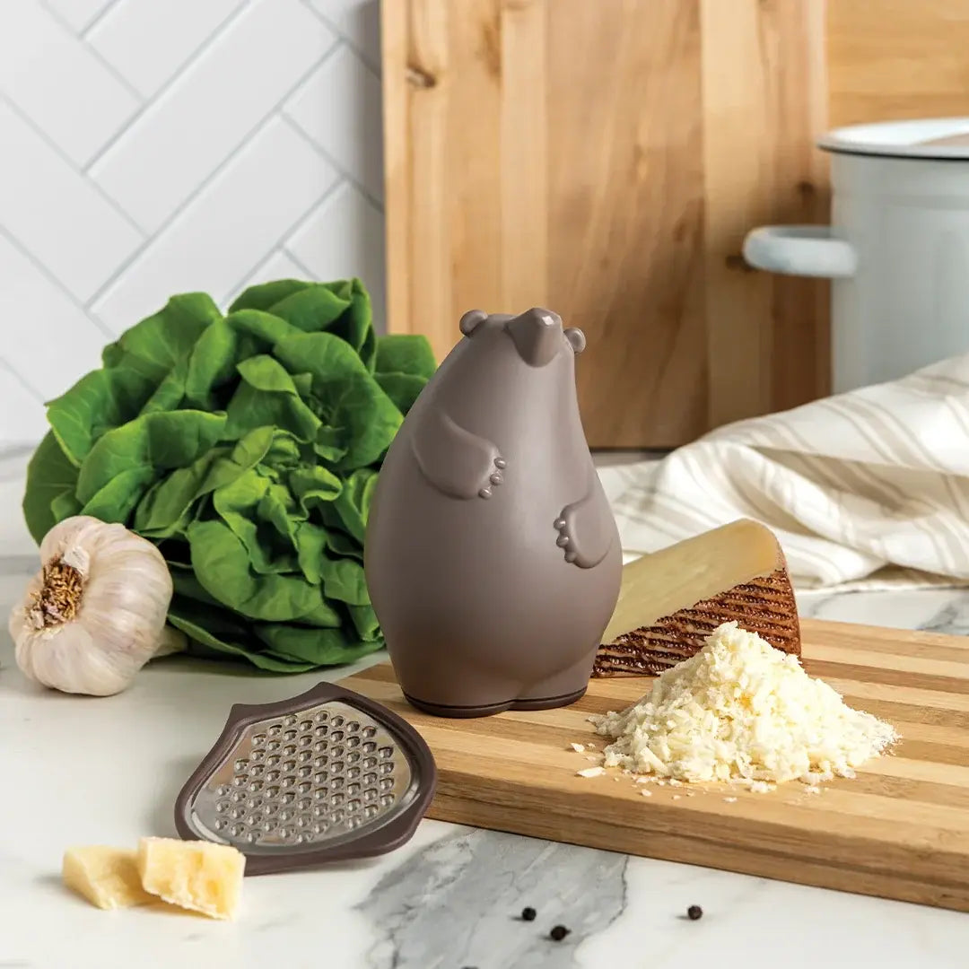 a cheese grater and a grater on a cutting board