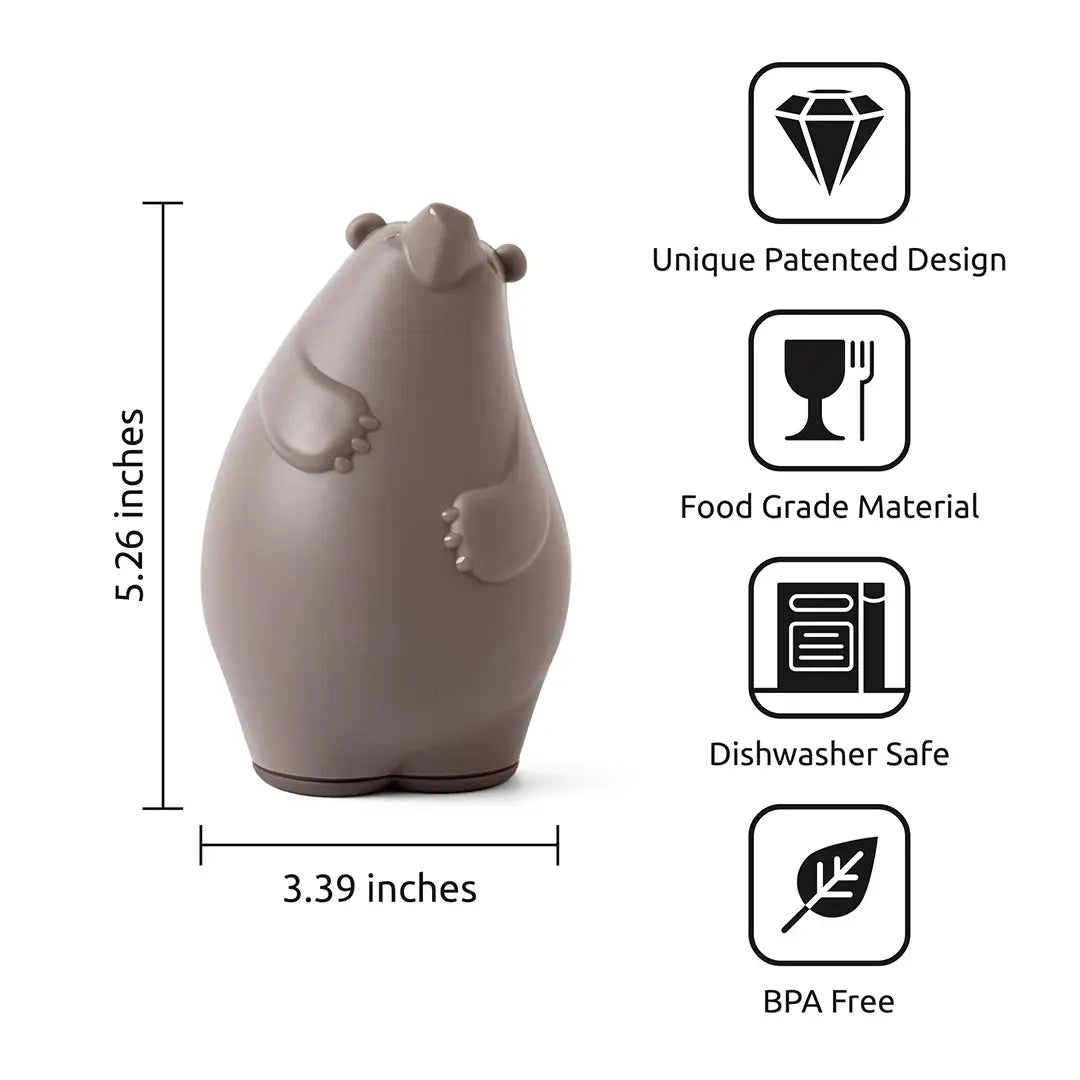 a small brown bear figurine with black text