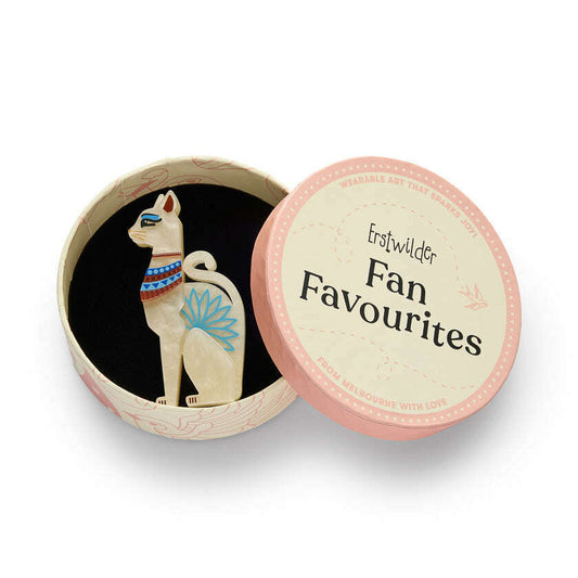 a cat figurine in a round box