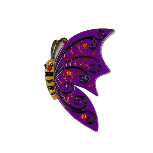 a purple butterfly with black swirls and red dots