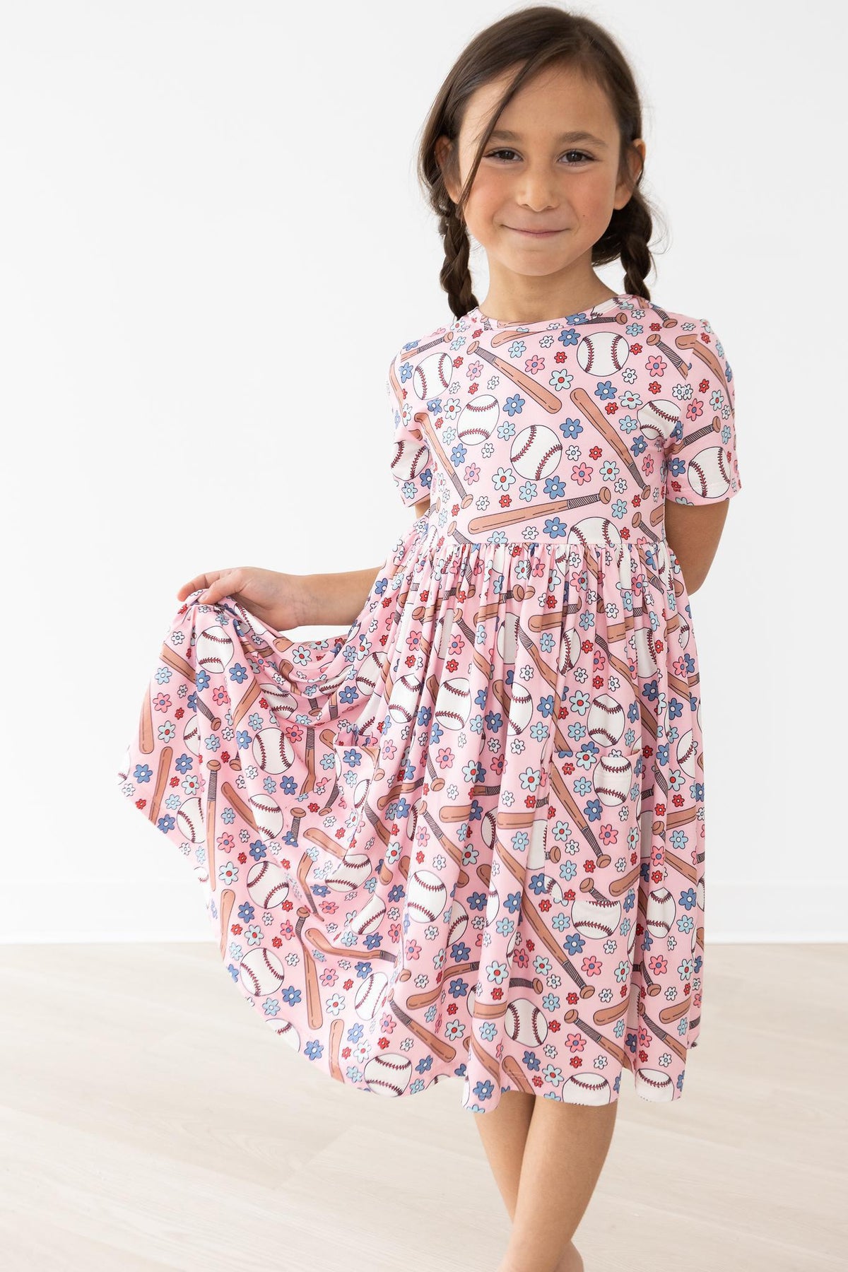 a girl in a pink dress