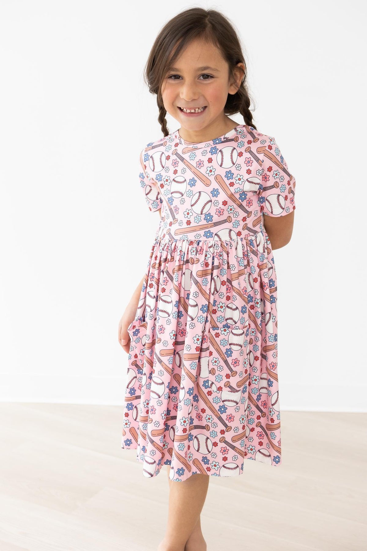 a girl in a pink dress