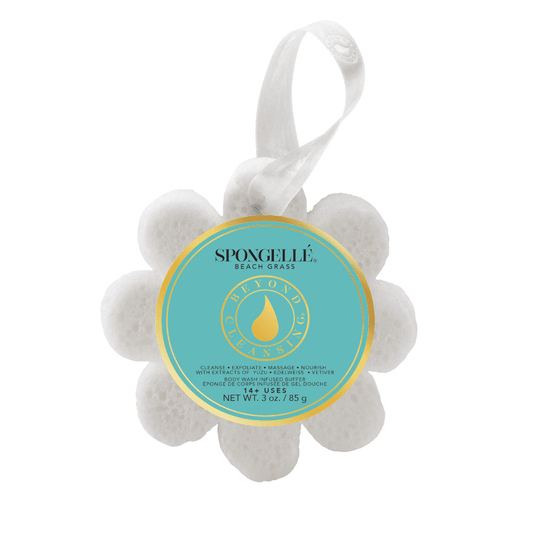 a white flower shaped object with a blue label