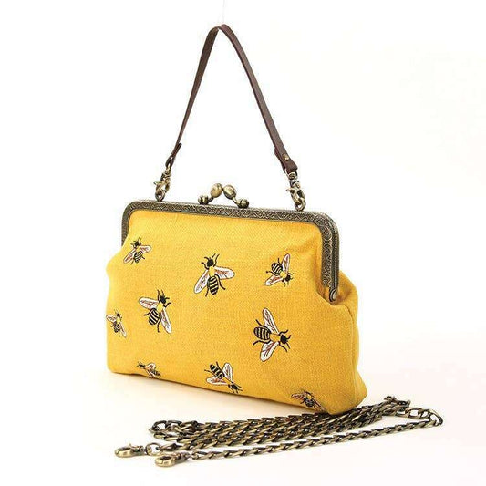 a yellow purse with bees on it