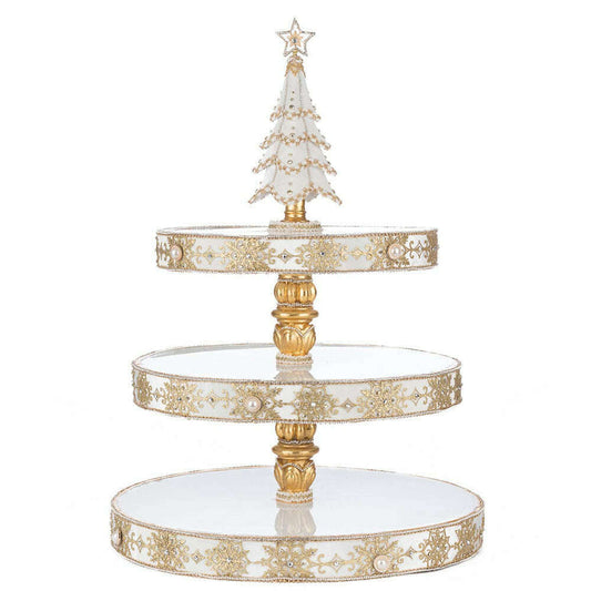 a three tiered tray with a christmas tree