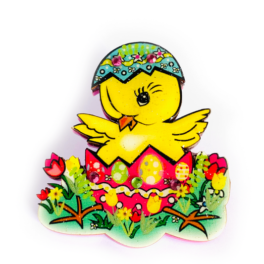 a yellow chicken with a egg in its shell