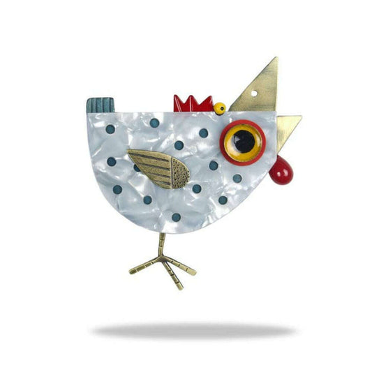 a metal bird with a red beak