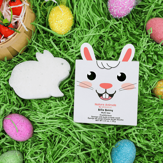 a paper bunny and eggs on grass