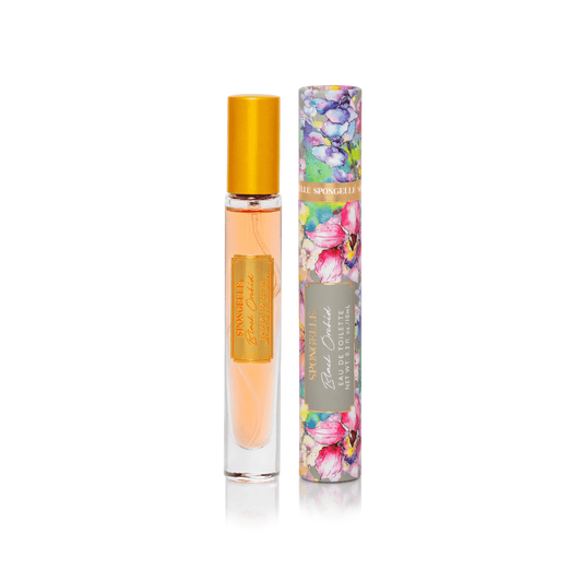 a bottle of perfume next to a tube of perfume