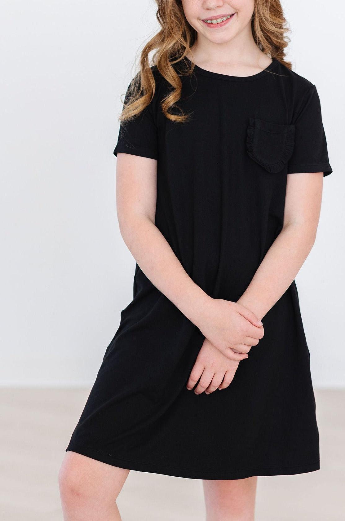 a woman in a black dress