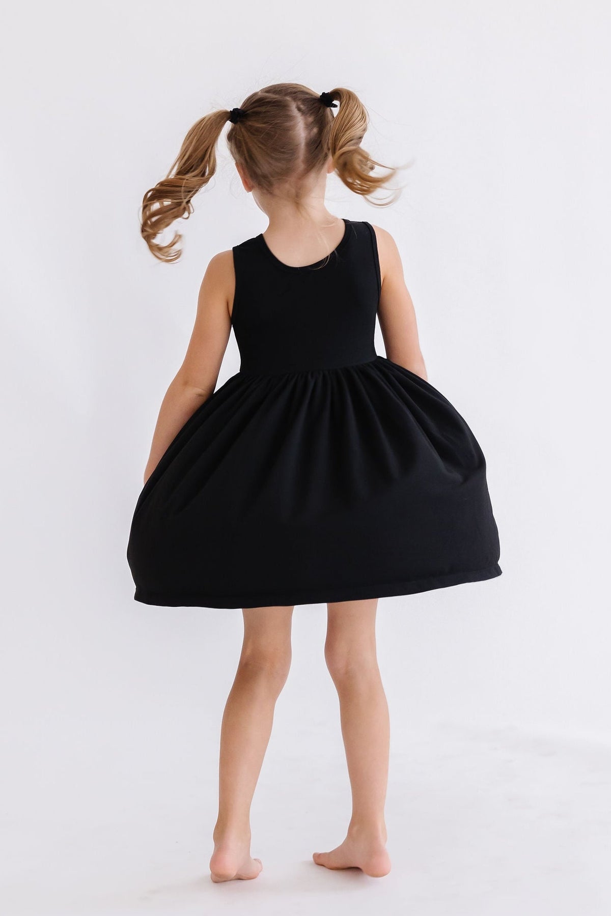 a girl in a black dress