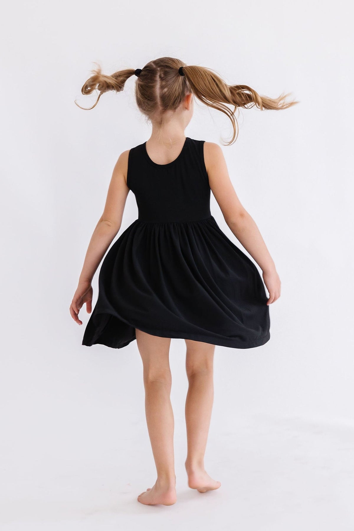 a girl in a black dress