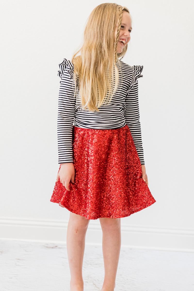 a girl in a red skirt