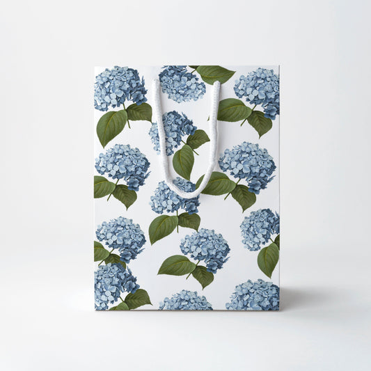 a white bag with blue flowers on it