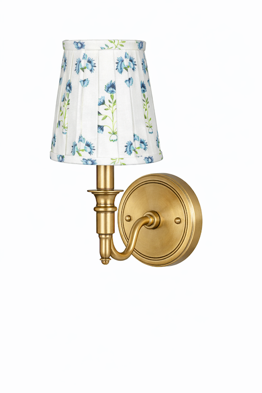 a light fixture with a white shade