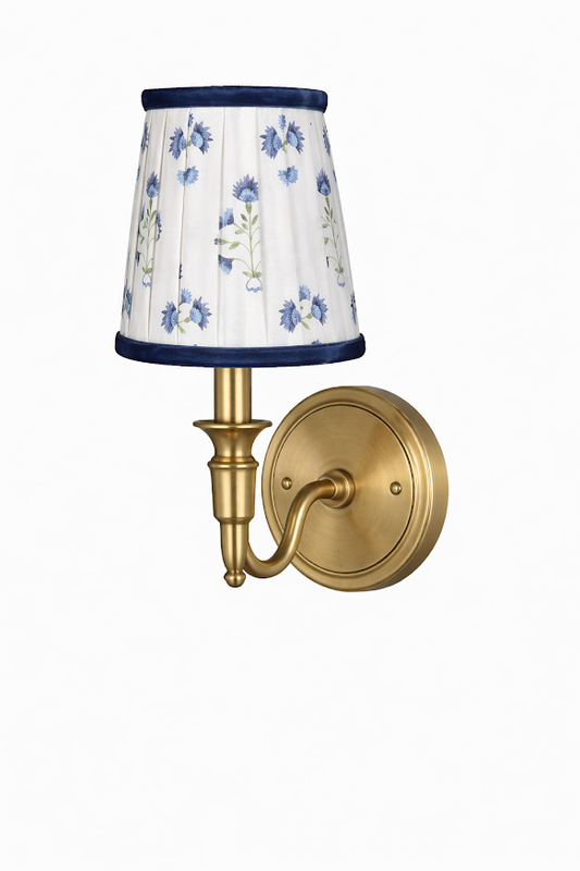 a light fixture with a white shade
