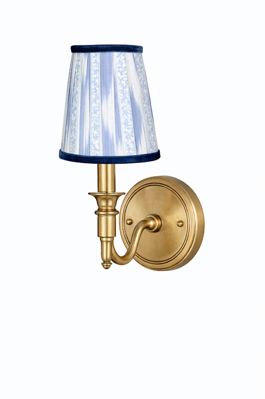 a light fixture with a blue and white shade