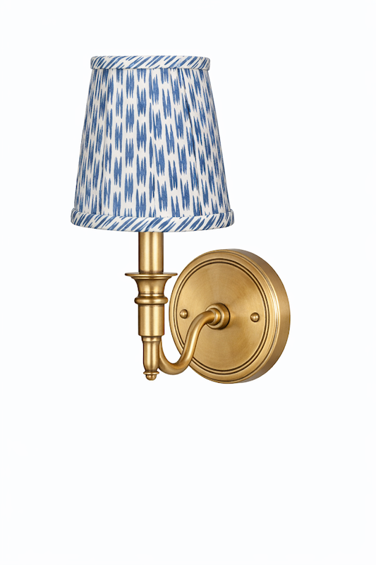 a light fixture with a blue and white shade