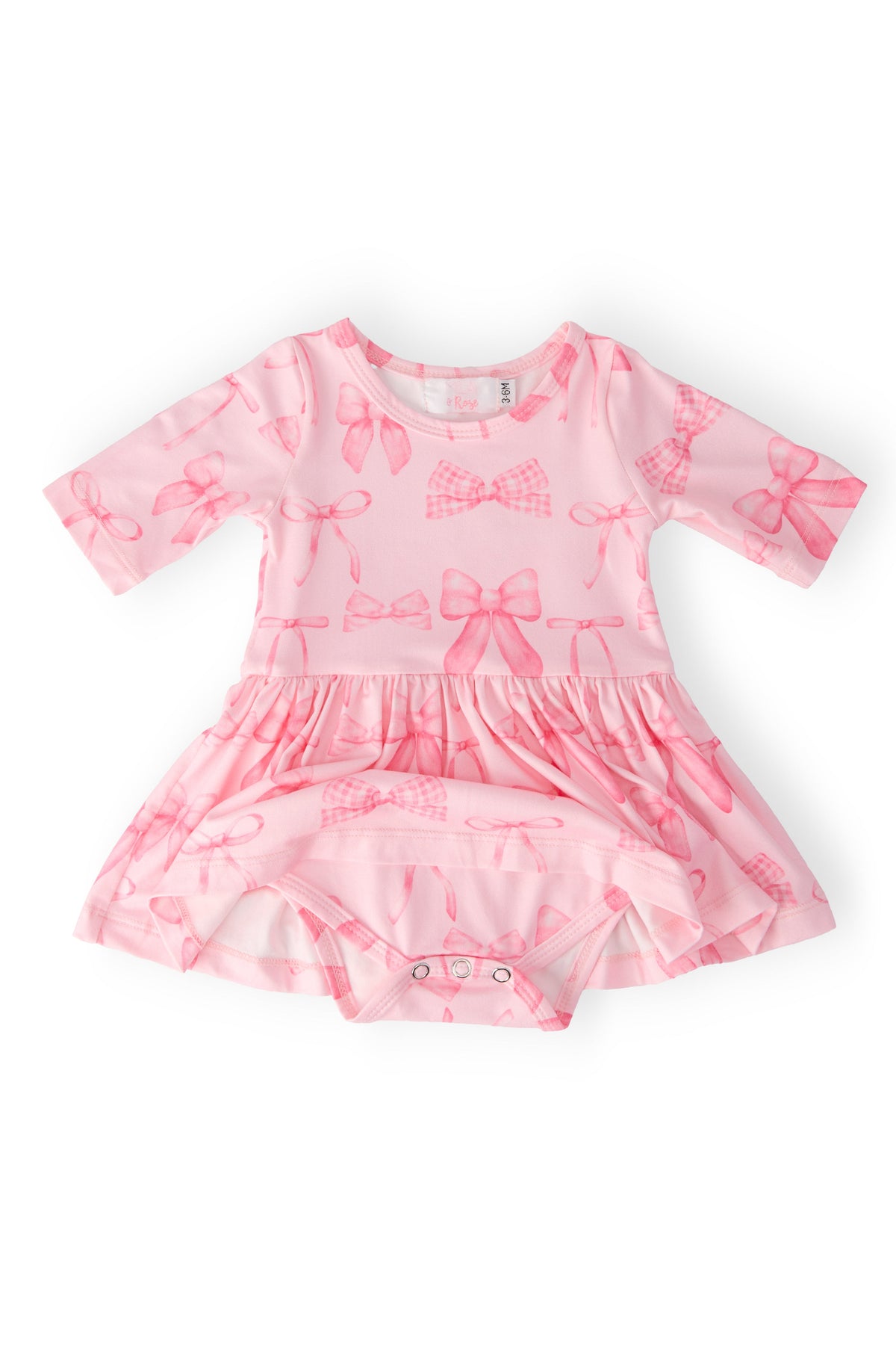 a pink dress with bows on it