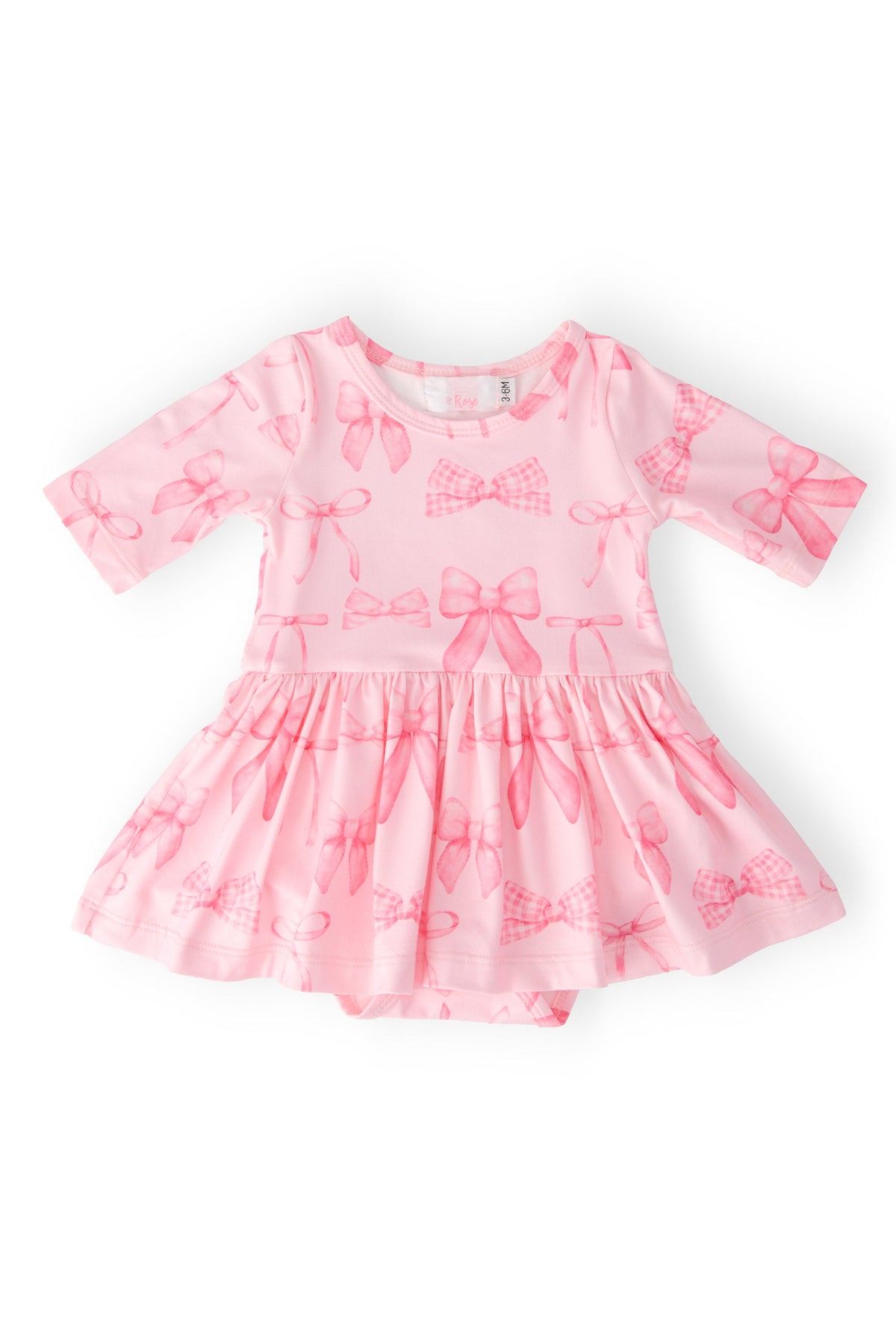 a pink dress with bows on it
