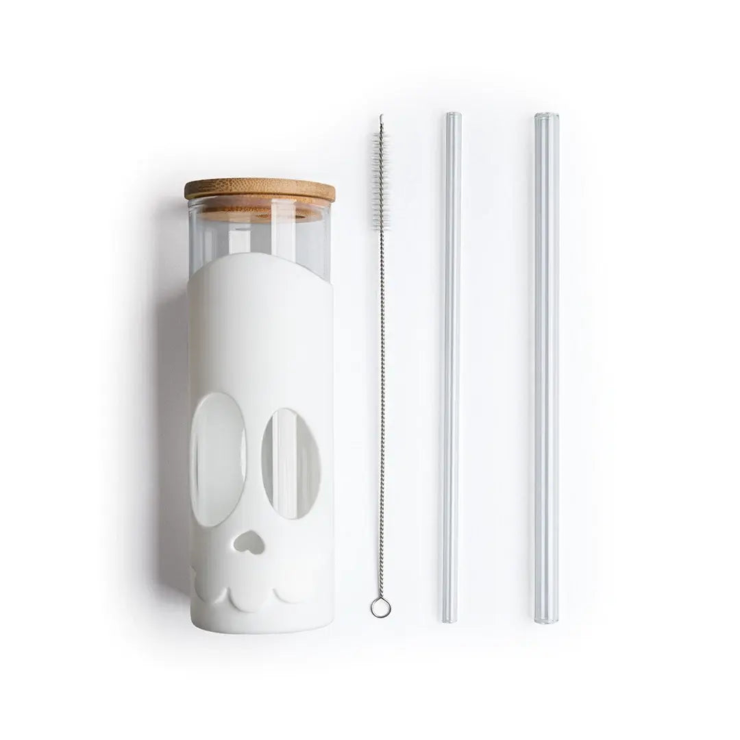 a glass bottle with a lid and straws