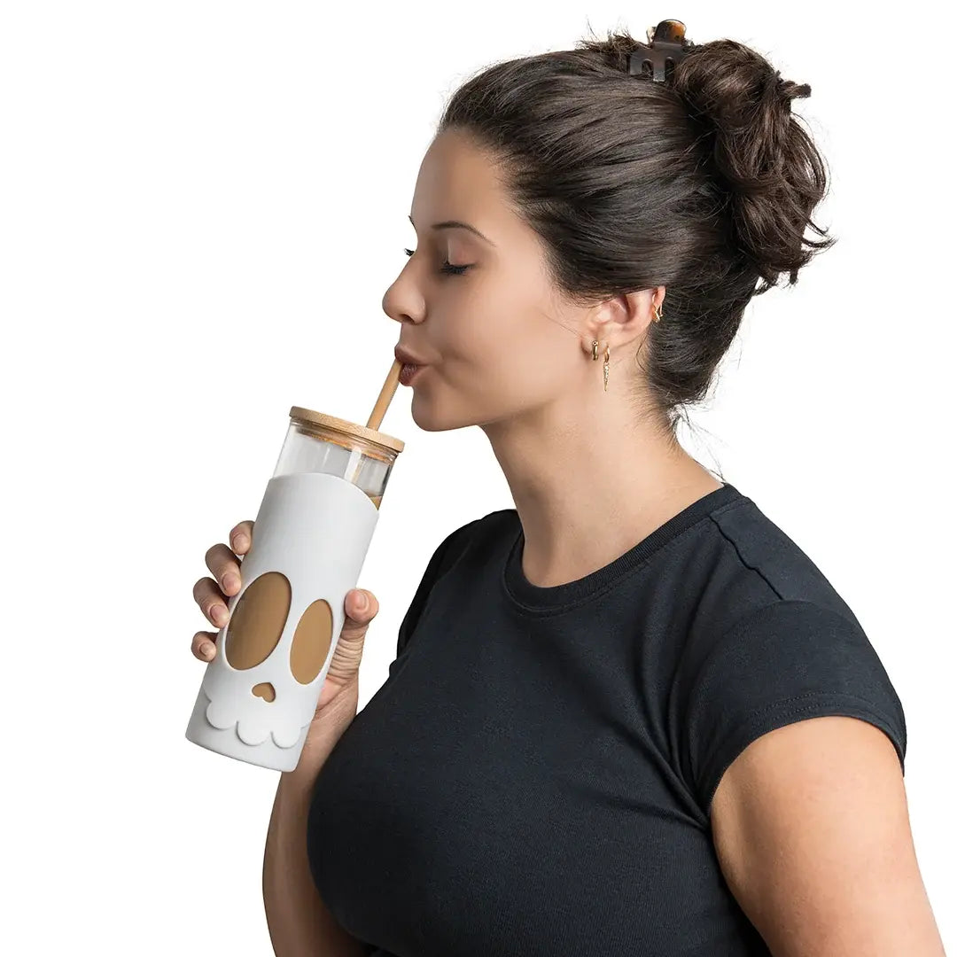 a woman drinking from a straw