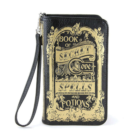 a black and gold book with a strap