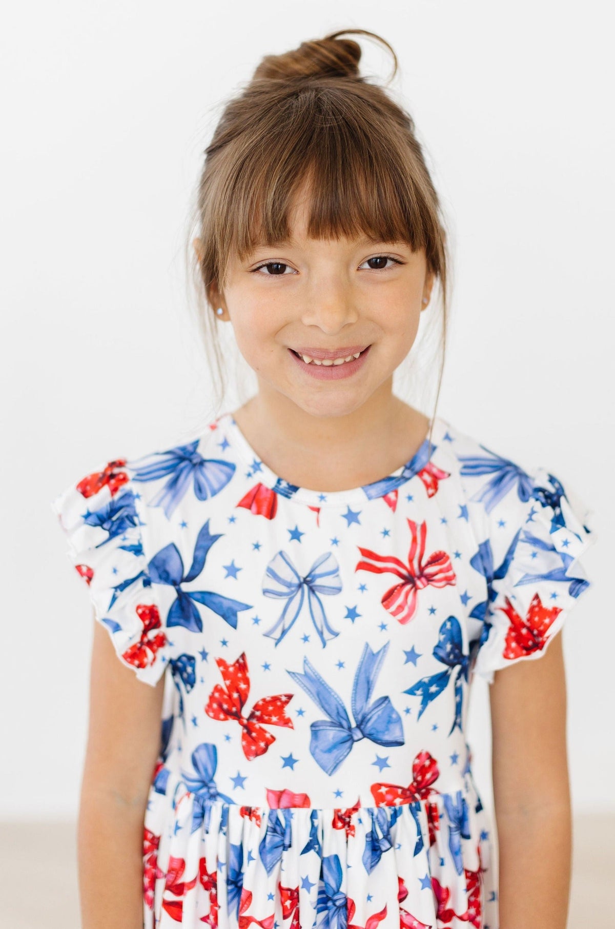 a girl smiling at the camera