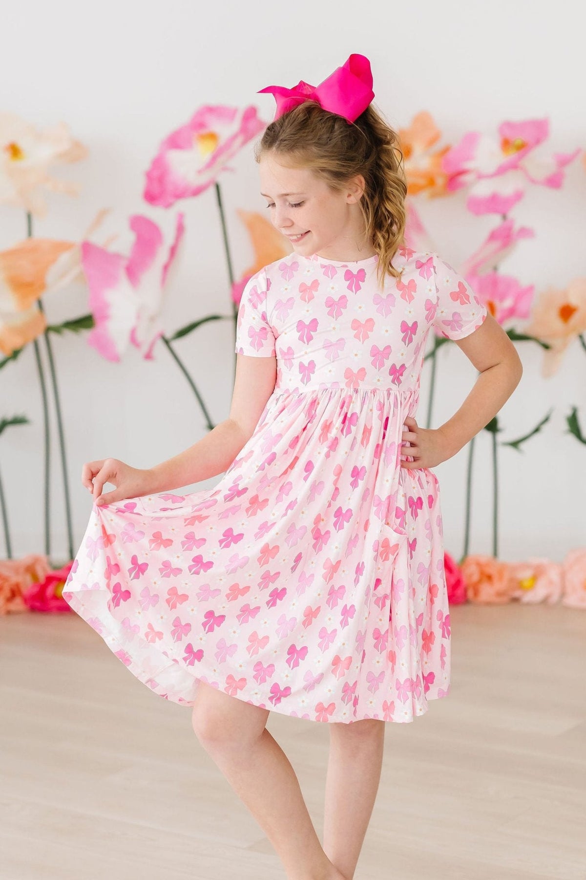 a girl in a pink dress