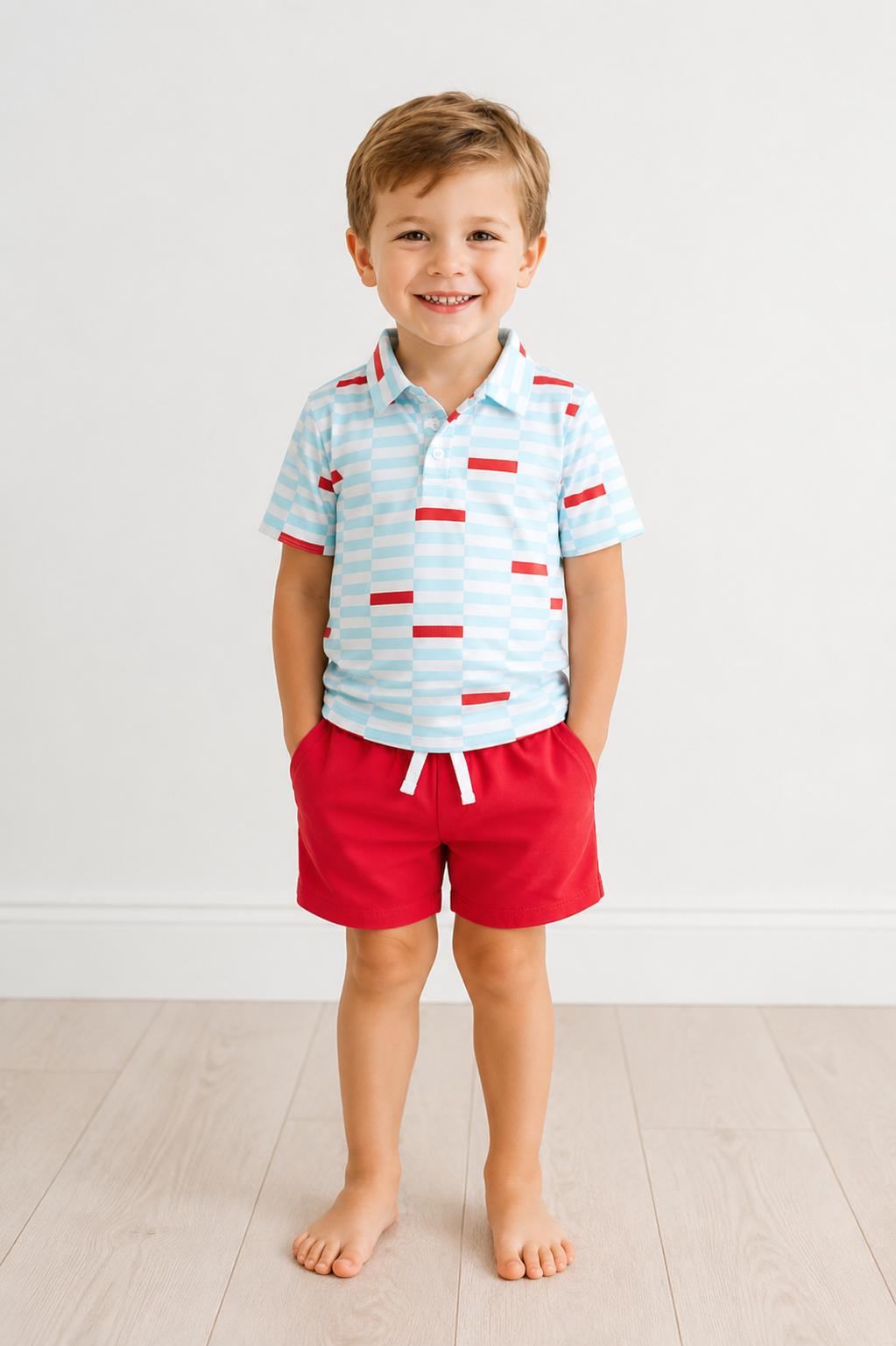 a boy standing with his hands in his pockets