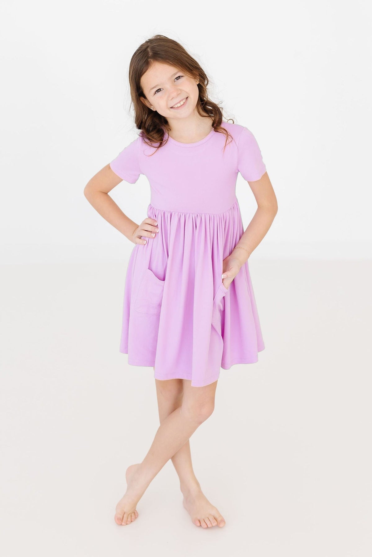 a girl in a purple dress