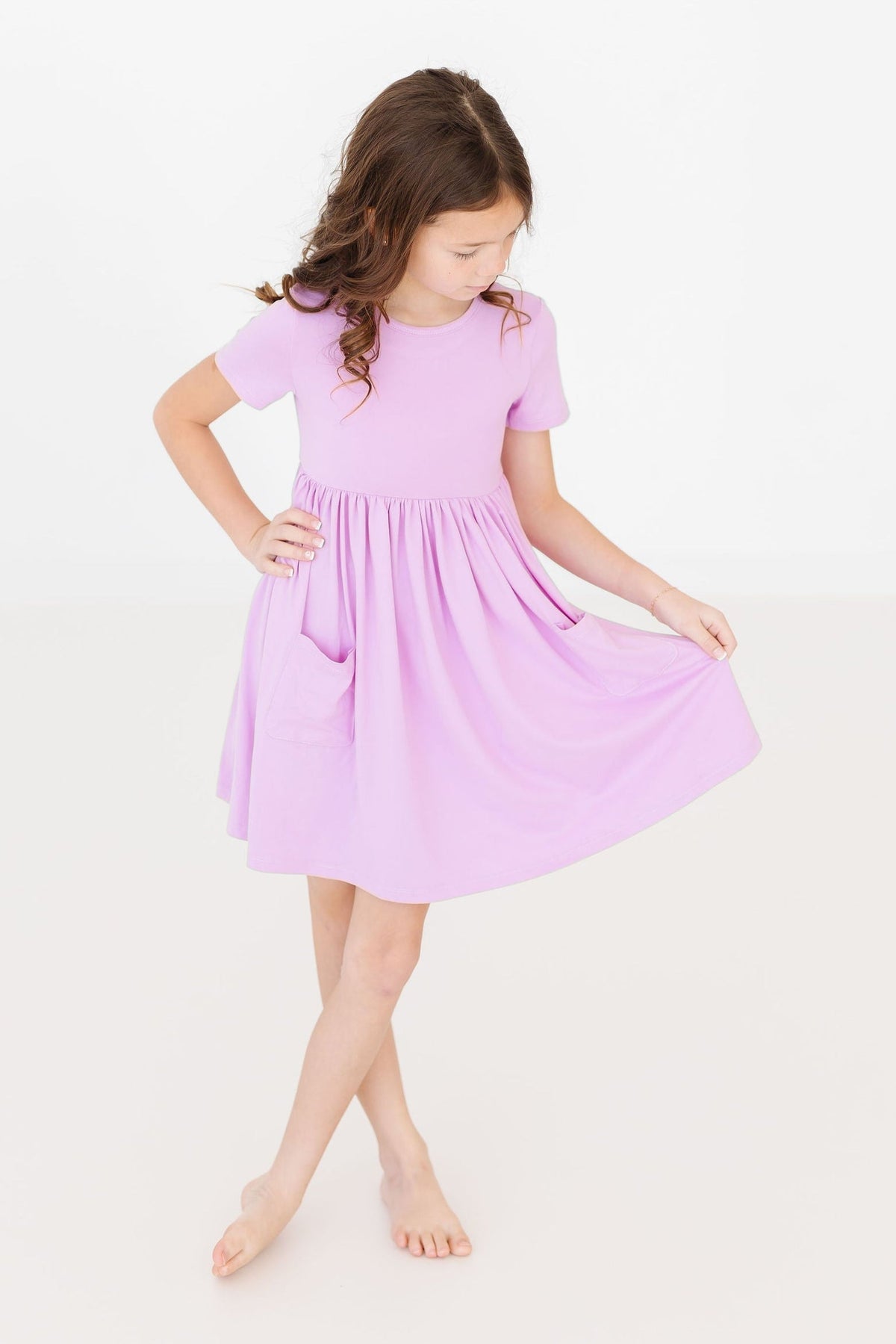 a girl in a pink dress