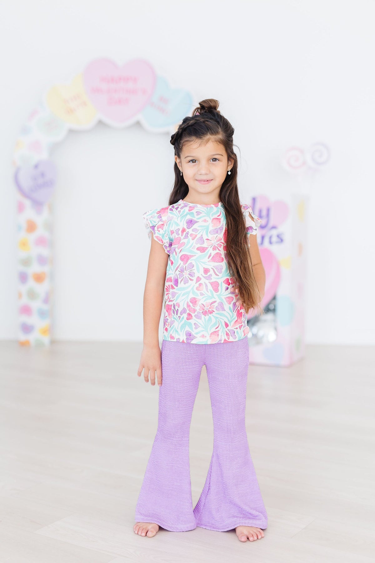 a girl standing in a room