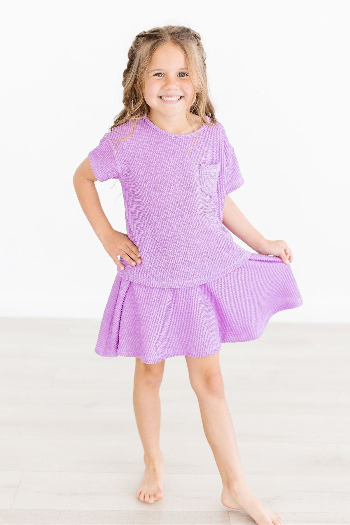 a girl in a purple dress