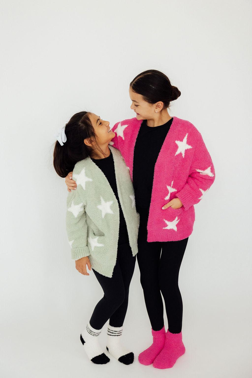 two girls standing together smiling