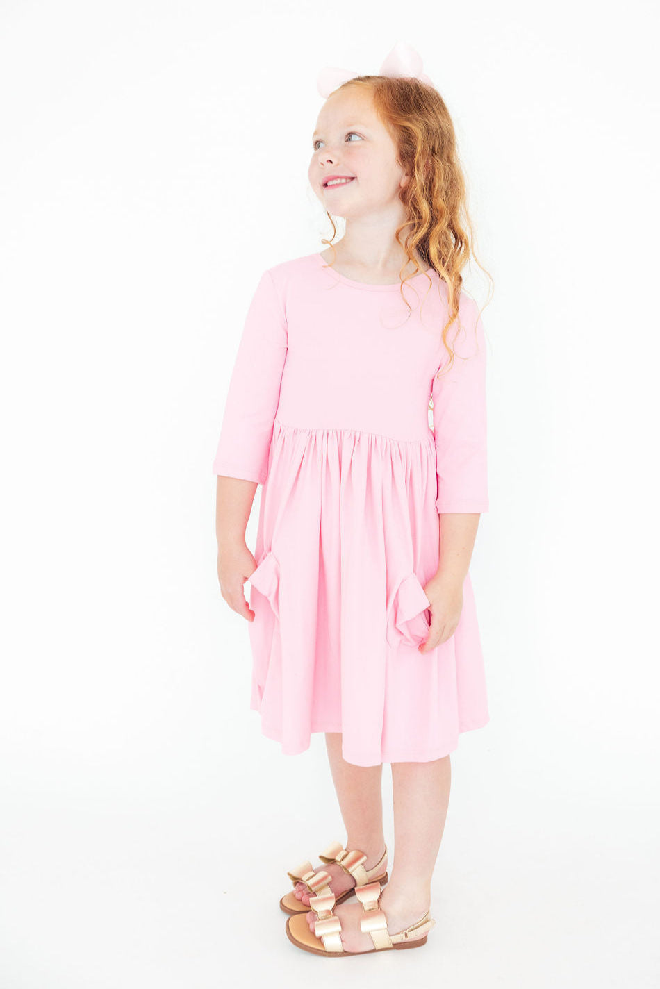 a girl in a pink dress