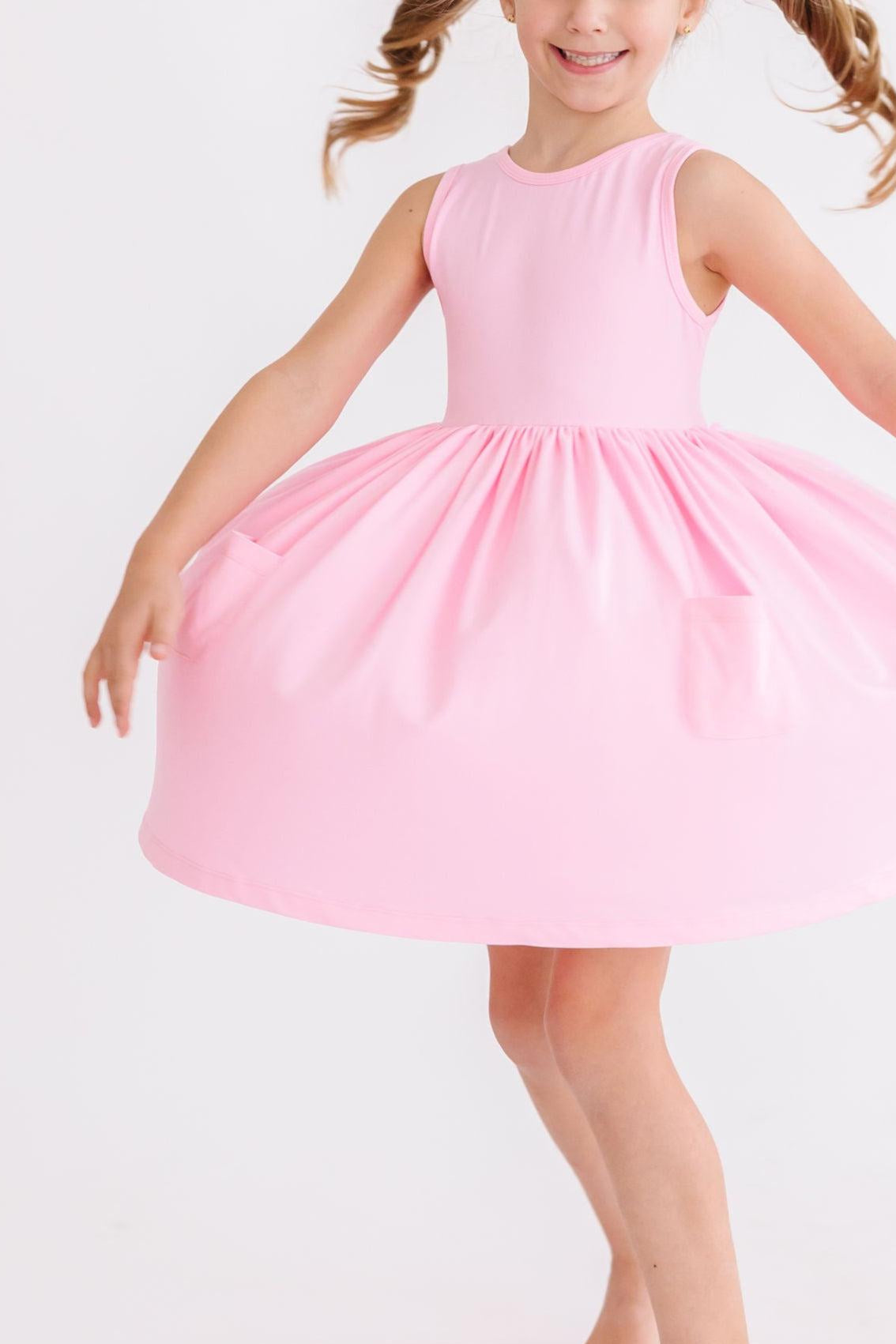 a girl in a pink dress