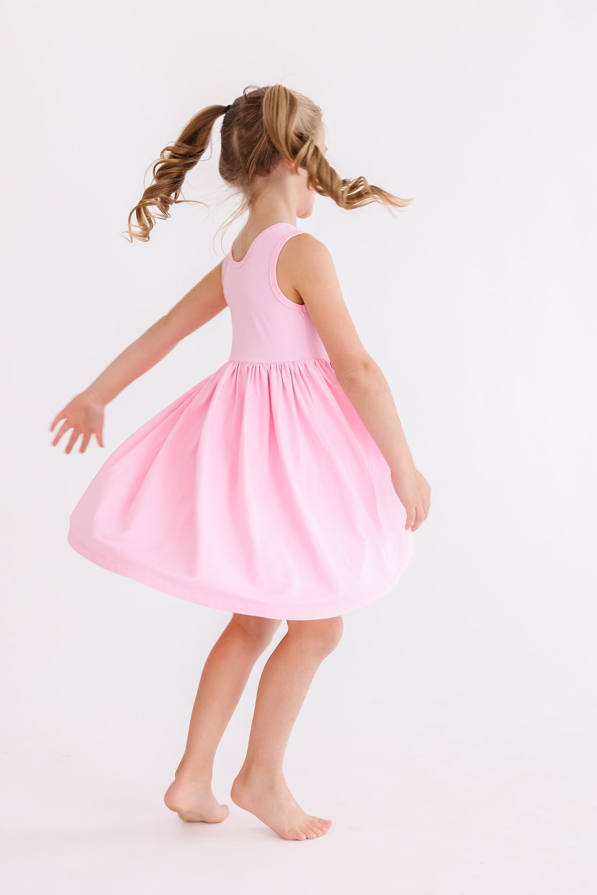 a girl in a pink dress