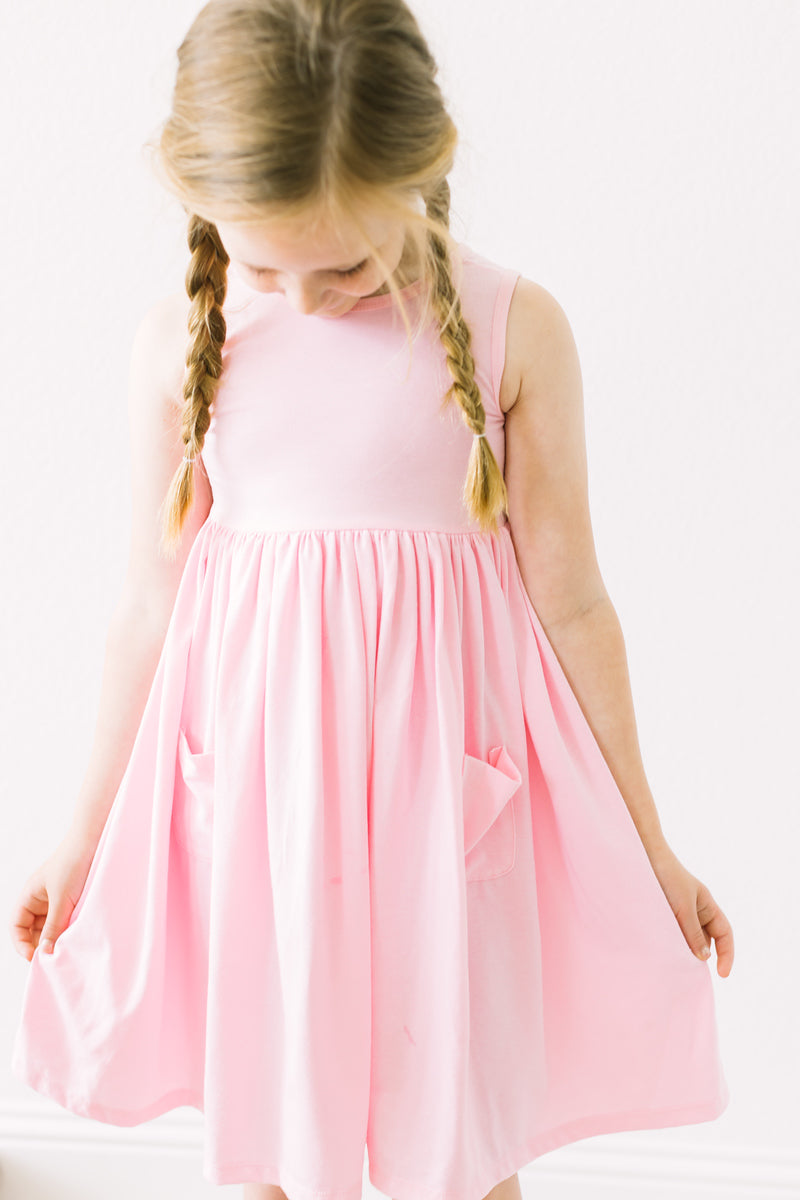 a girl in a pink dress