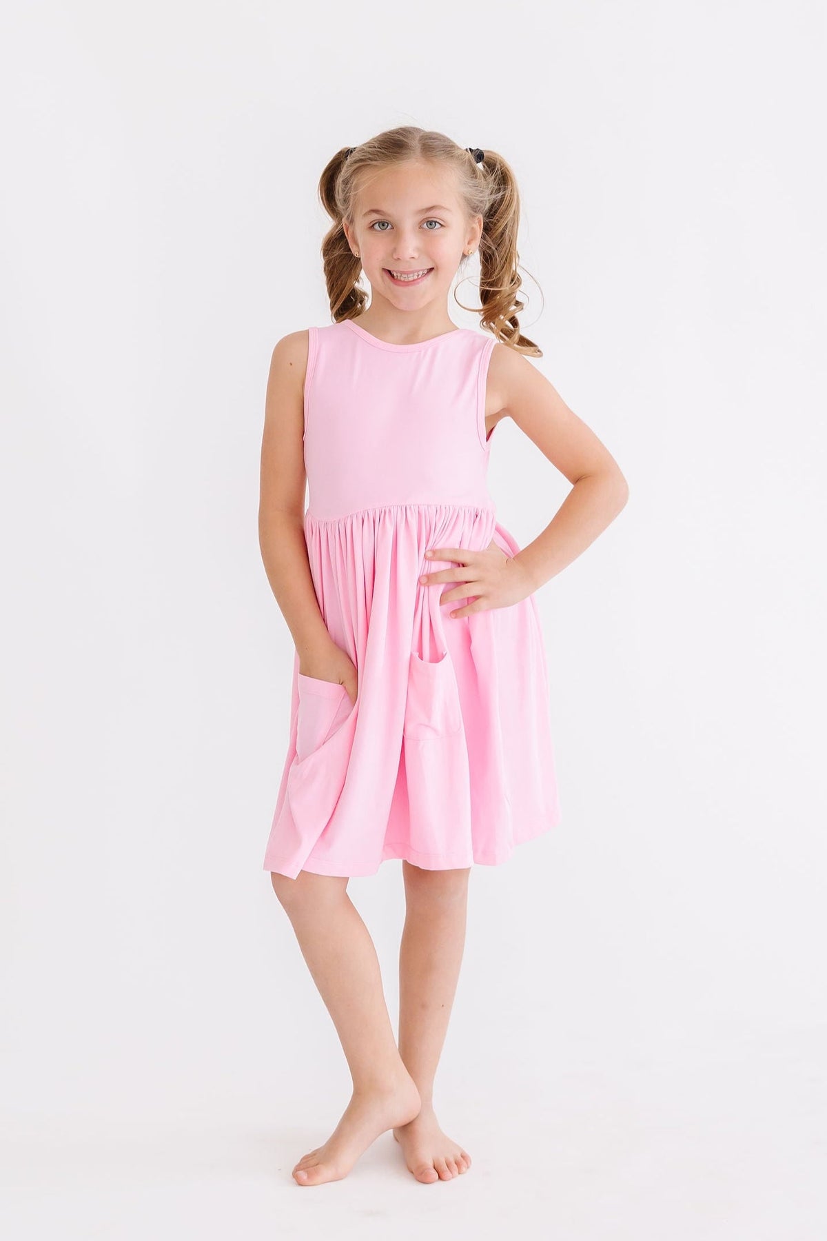 a girl in a pink dress