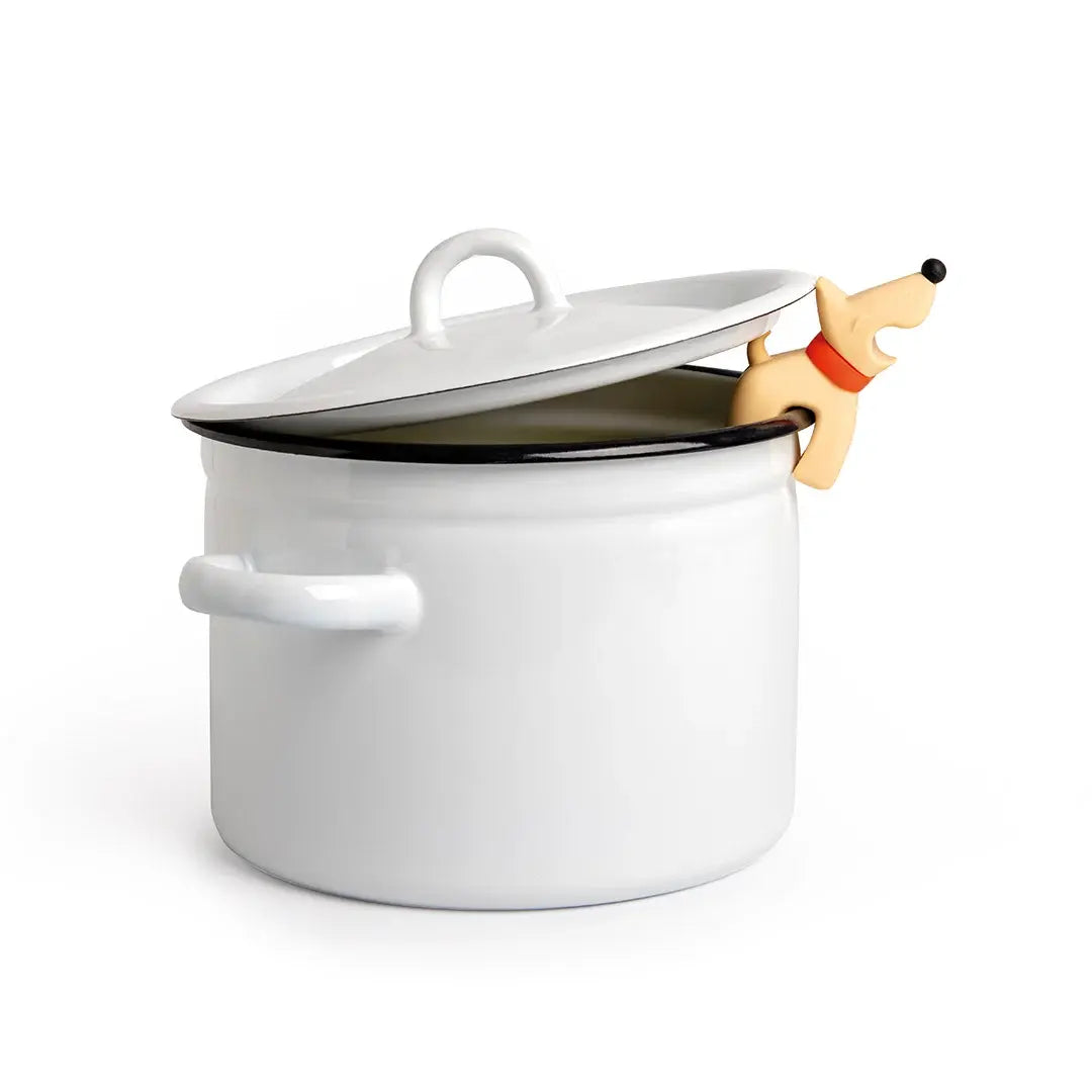 a white pot with a dog toy on it
