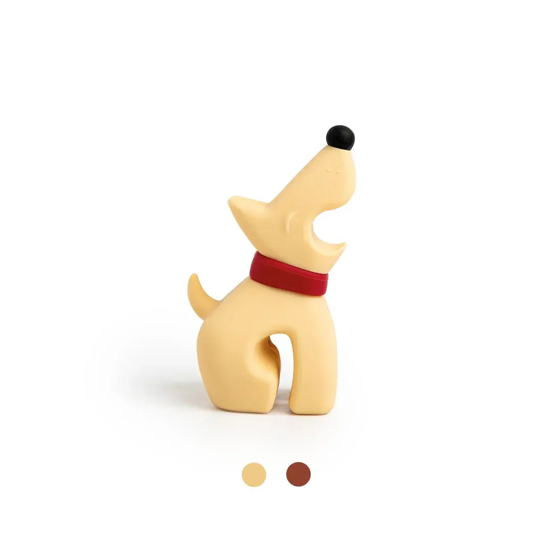 a dog figurine with a red collar