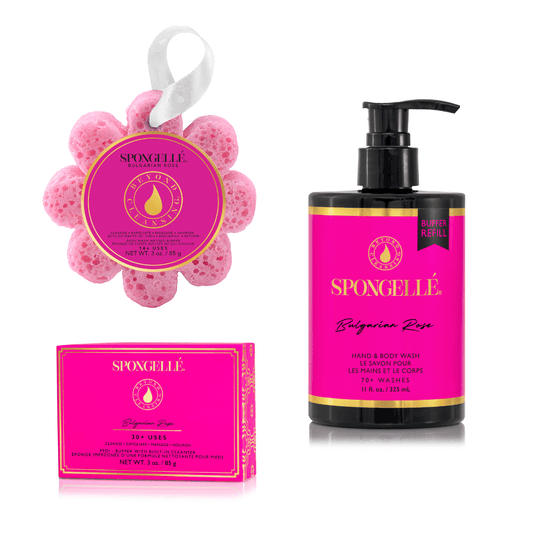 a pink and black bottle with a pink flower and a pink flower