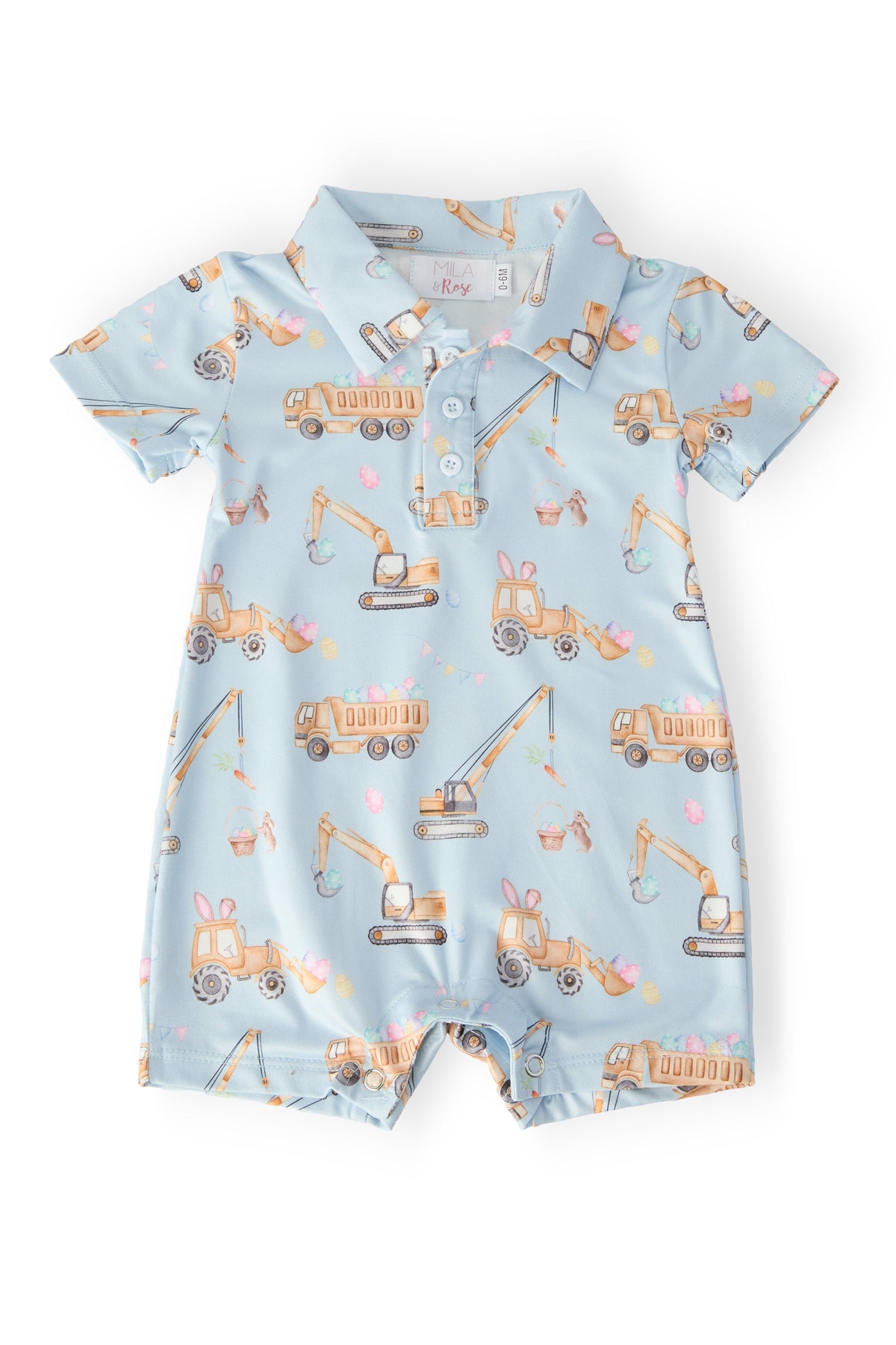 a baby romper with construction vehicles on it