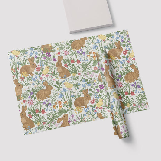 a paper with a pattern of rabbits and flowers