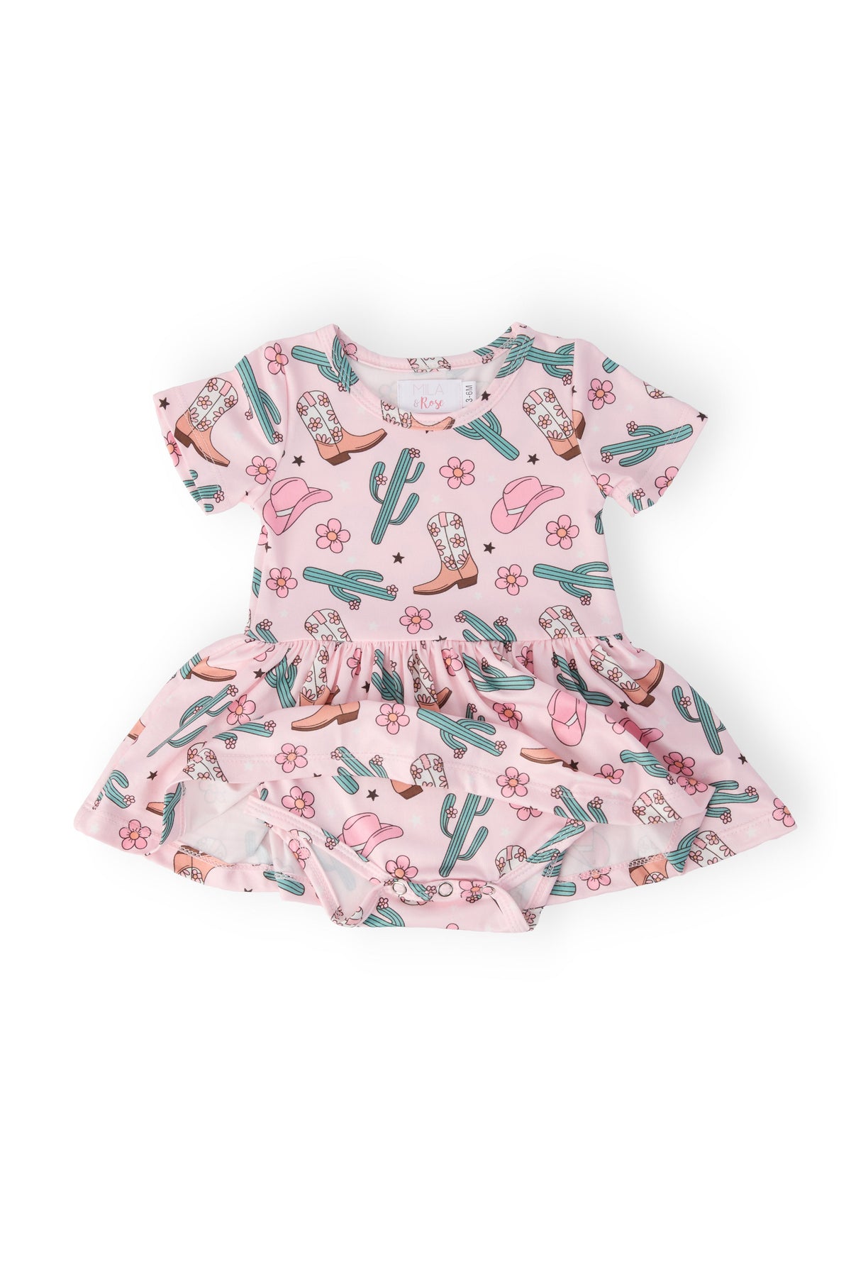 a pink dress with cactuses and cowgirls on it
