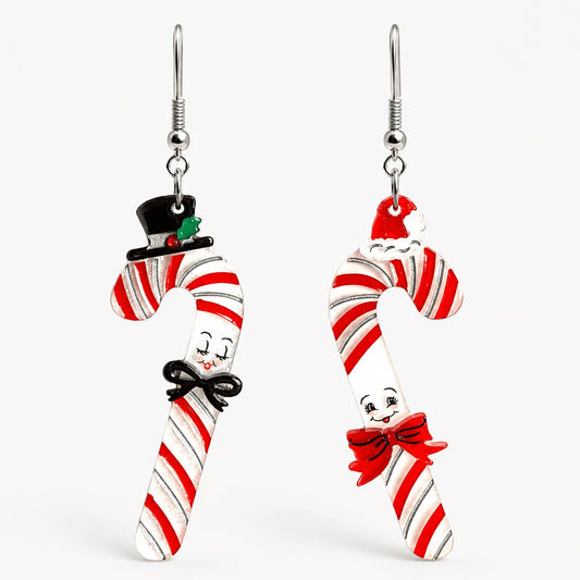 a pair of earrings with candy canes