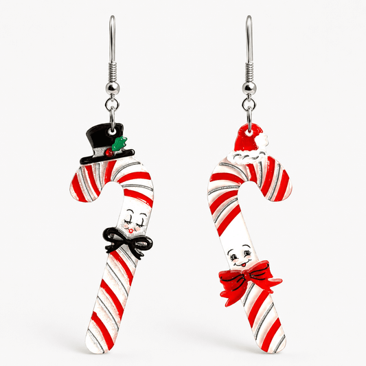 a pair of earrings with candy canes