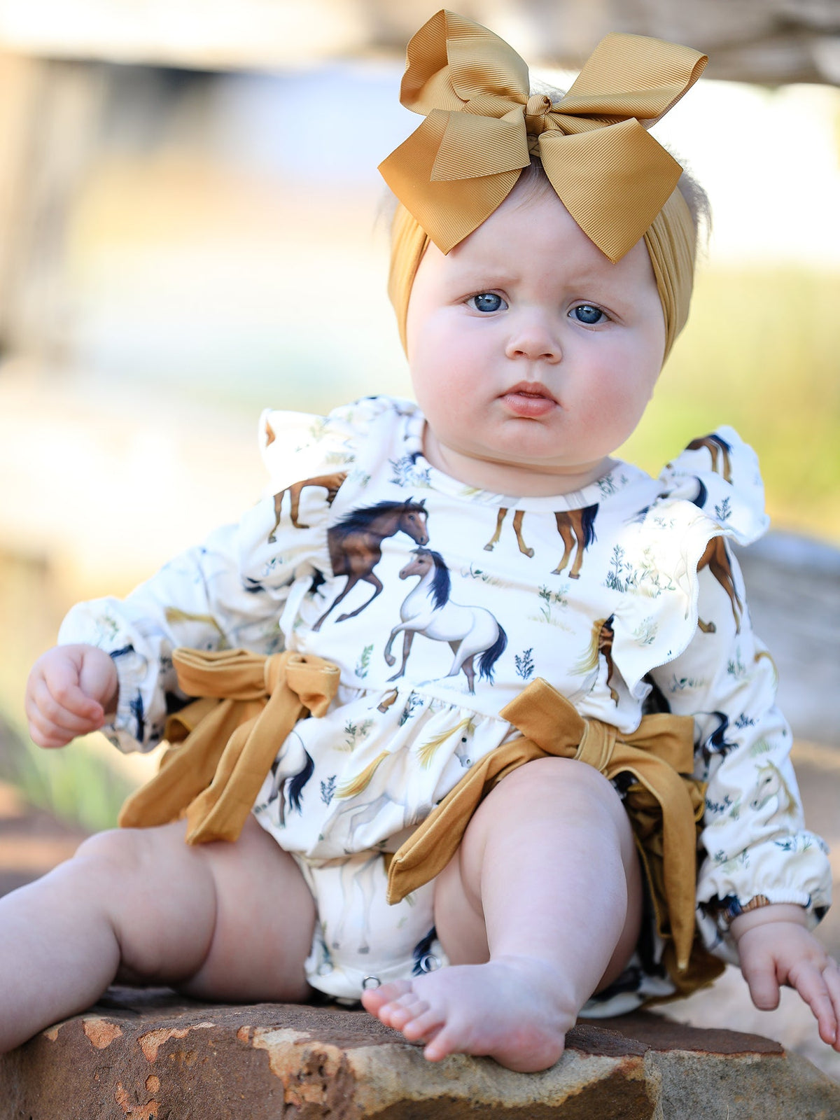 a baby with a bow on her head