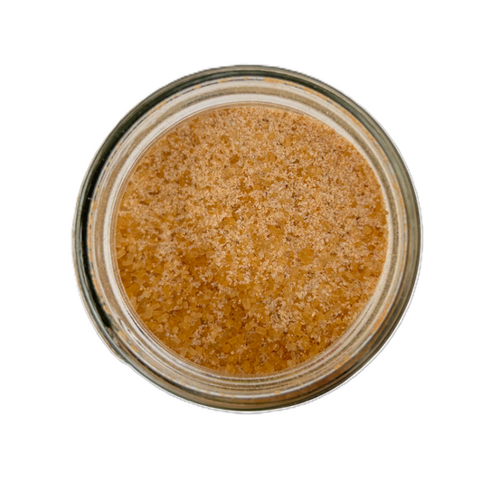 a glass jar with brown substance